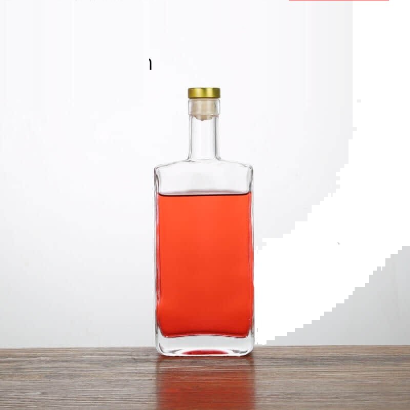 Square liquor bottle, 500 ml, filled with a rose-coloured spirit