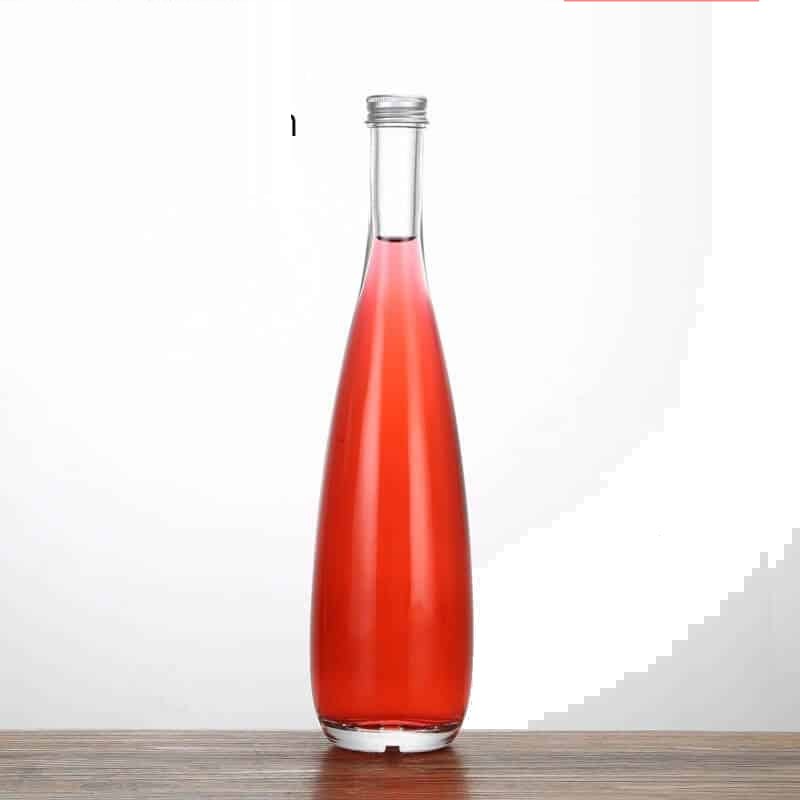 Tall liquor bottle, 500 ml, filled with a rose-coloured spirit